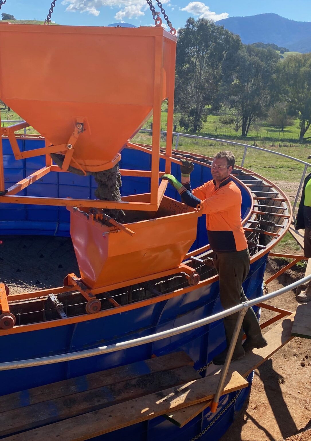 pouring cement on concrete water tank construction