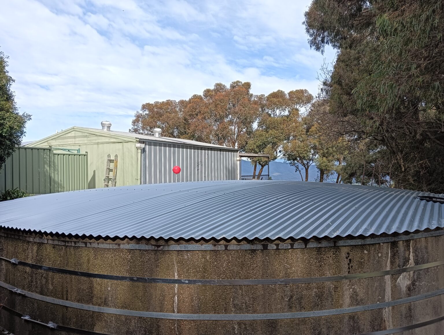 corrugated iron tank roof on a repaired tank